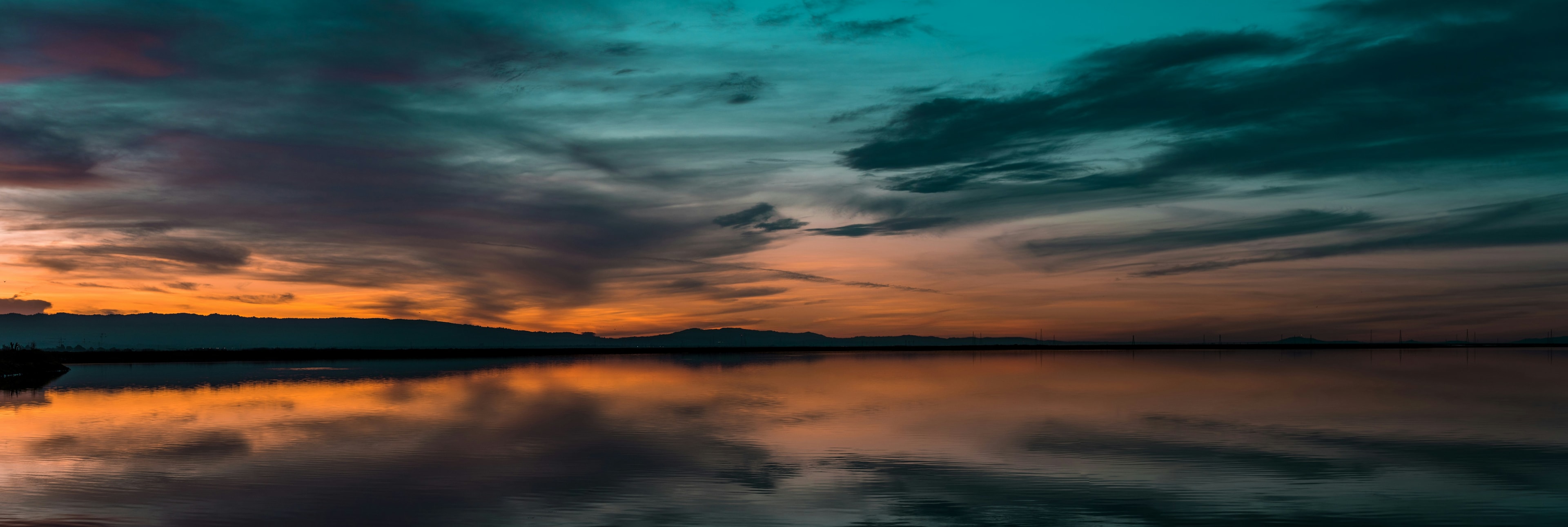 Dramatic sunset over calm water